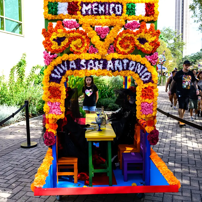 Día de los Muertos ofrenda featuring a shared meal connecting Mexico and San Antonio