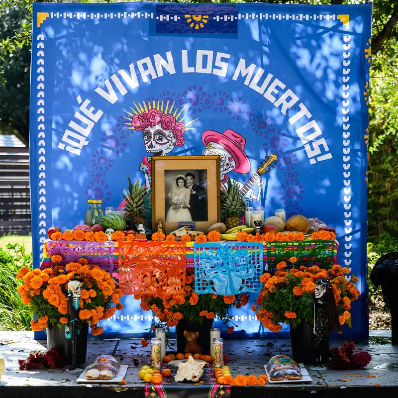 Muertos Fest workshop ofrenda displaying traditional Día de los Muertos offerings with explanations of their meaning