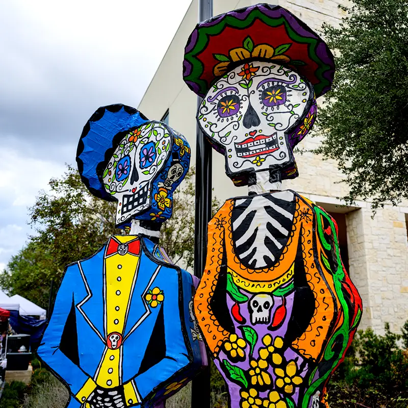Colorful Catrín and Catrina iconic figures Día at Muertos Fest in Hemisfair