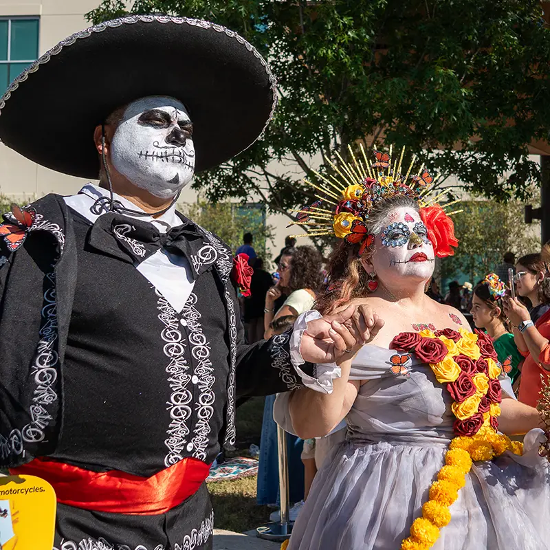 Participants in traditional Día de los Muertos procession at Muertos Fest in San Antonio, Texas